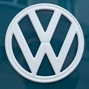 silver mercedes benz emblem on blue surface