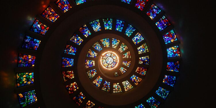 worms eye view of spiral stained glass decors through the roof